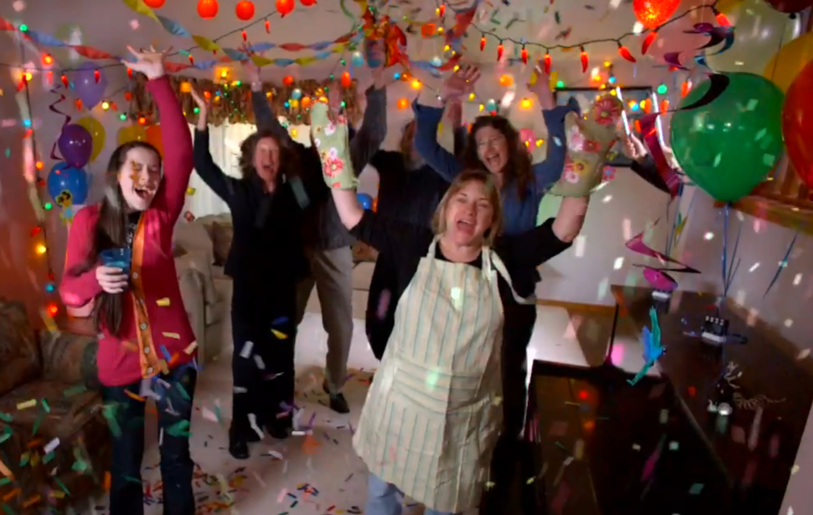 A party scene with balloons, suggesting a celebratory theme